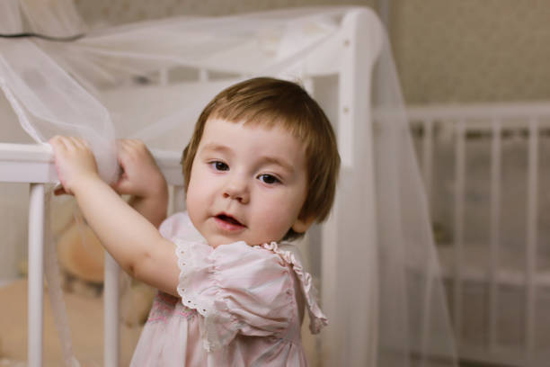 istock litle kid stand at bedroom 856030852
