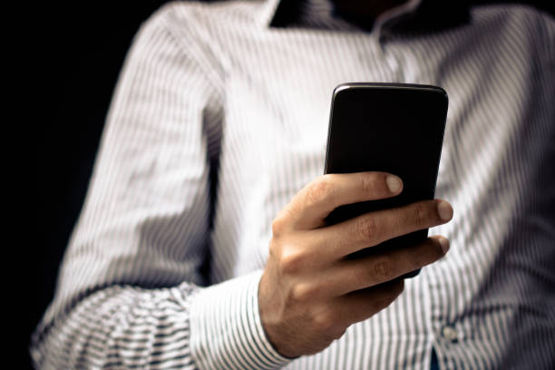 istock Close up of man using mobile phone. 856030878