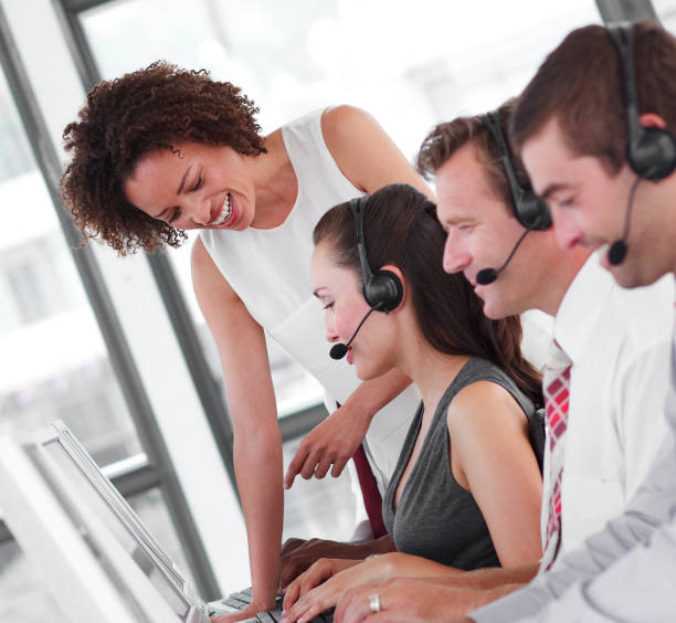 istock Smiling female manager with her sale representative team 856035484