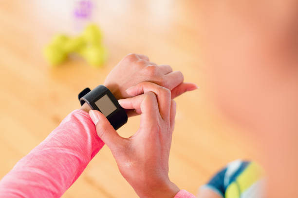 istock Woman using smartwatch in the gym 856035736