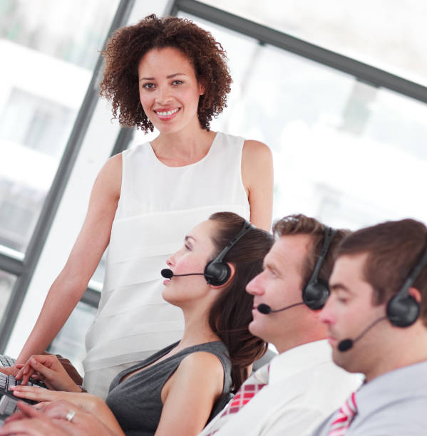 istock Smiling female manager with her sale representative team 856038348