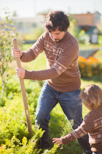 istock Father and child working in the garden 856038404