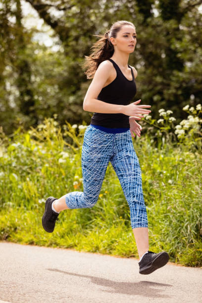 istock Woman jogging in the park 856039490
