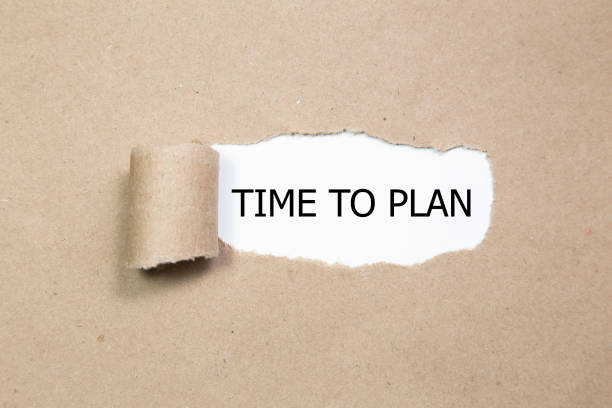 istock The words time to plan appearing behind torn paper 856043598