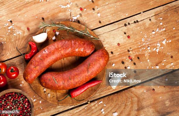 Raw Sausages On Wooden Background Stock Photo - Download Image Now - Sausage, Smoked Sausage, Raw Food