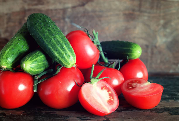 istock tomatoes on wooden background 856049520