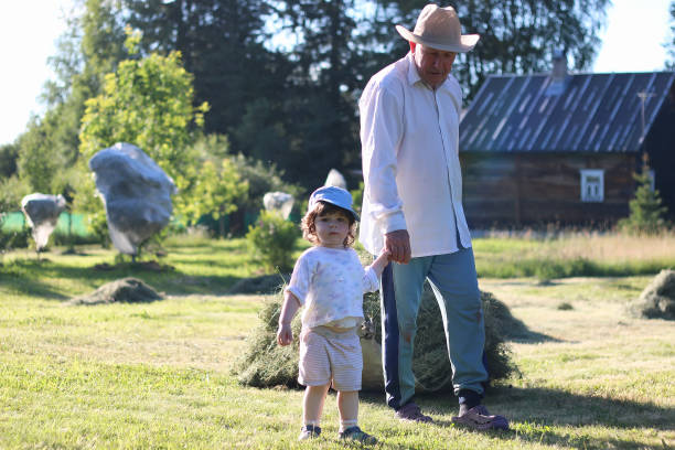 istock child and grandfather harvested hay 856053948
