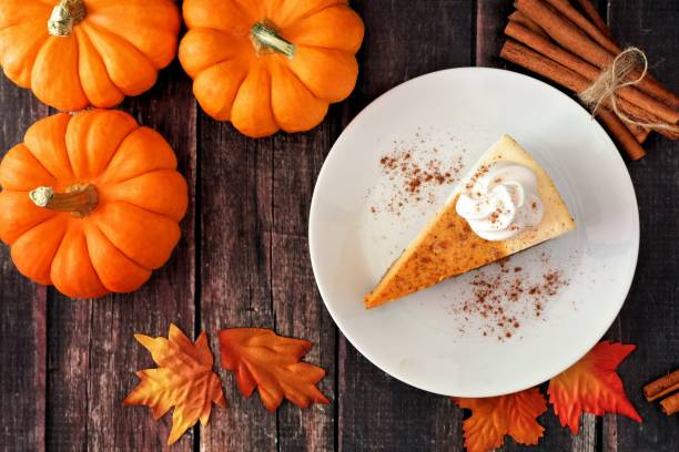 istock Slice of pumpkin cheesecake, top view on rustic wood 856062110