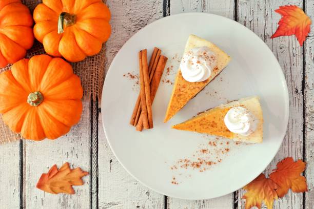 istock Plate with two slices of pumpkin cheesecake, overhead view 856062128