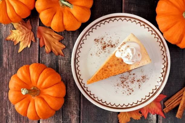 istock Slice of pumpkin cheesecake, overhead table scene 856062134