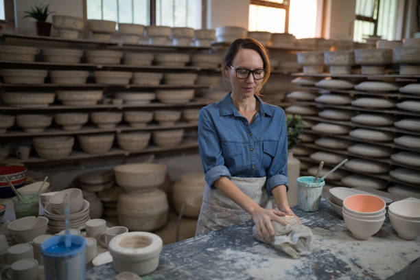 istock Female potter molding a clay 856062686