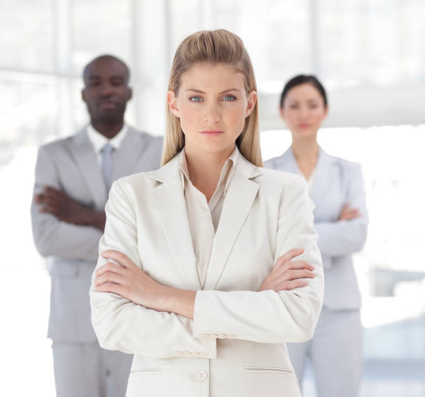 istock Charming businesswoman standing at the camera with arms folded 856076204