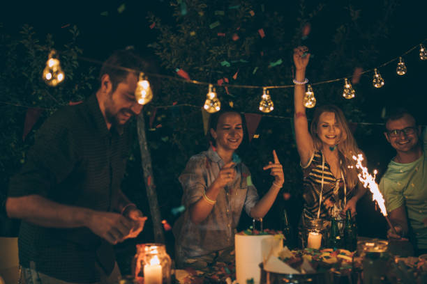 istock Group of young friends having fun at backyard party 856076570