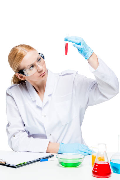 istock a concentrated laboratory assistant wearing glasses and gloves makes experiments with liquids in test tubes 856083396