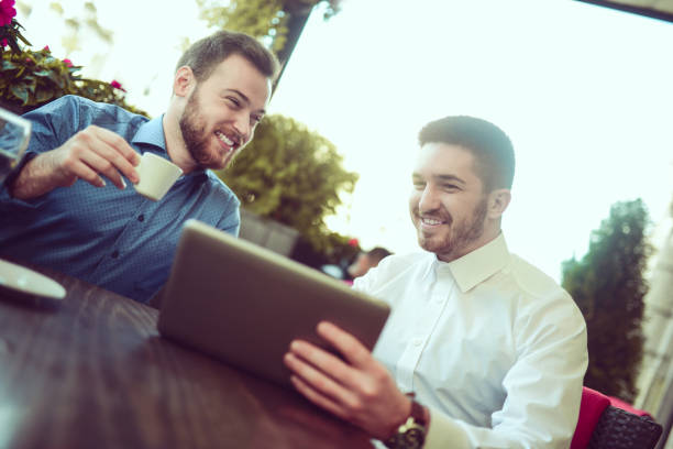 istock Business Colleagues using Digital Tablet in a Cafe Restaurant 856084026