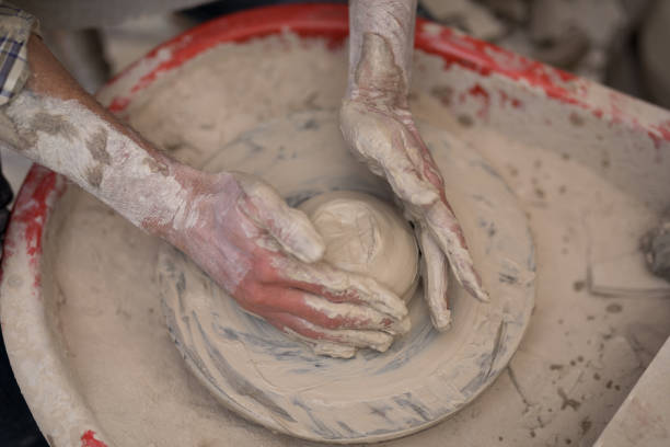 istock Male potter molding a clay 856086566