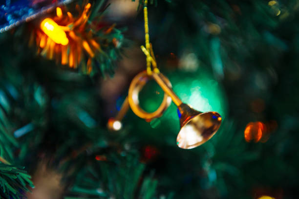 This is a horizontal, color photograph of a traditionally decorated Christmas tree inside an American home. Photographed with a Nikon D800 DSLR camera.