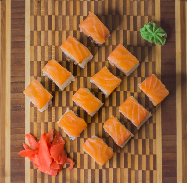 istock The set of salmon rolls on bamboo board 856087302