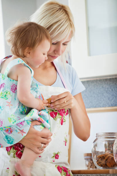 istock Smiling family having fun iin the kitchen 856087414