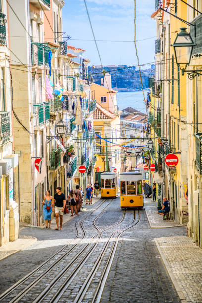 Lisbon Bica Funicular Lisbon, Portugal - August 26, 2017: Bica funicolar intersection point.The Ascensor da Bica is considered Lisbon's most picturesque funicular, leading up to Bairro Alto with scenic views of Tagus River santa justa lift portugal stock pictures, royalty-free photos & images