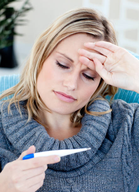 istock Attentive woman taking her sick tempretaure 856093924