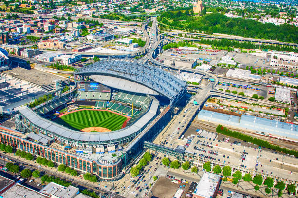 Safeco Field Aerial Seattle, United States - June 6, 2016:  Safeco Field, the home of Major League Baseball's Seattle Mariners, as shot from an orbiting helicopter at an altitude of about 1000 feet on a clear summer afternoon. american league baseball stock pictures, royalty-free photos & images