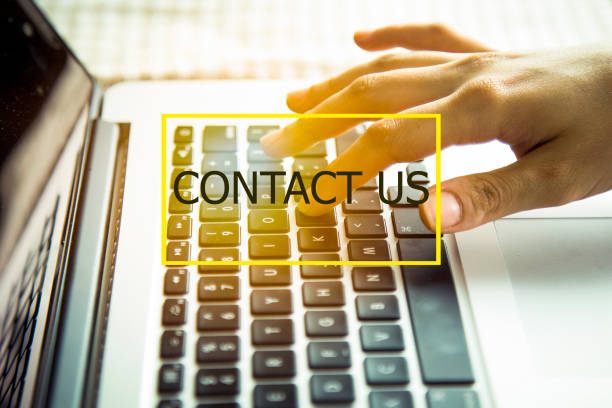 istock business woman using laptop computer. Technology Concept: contact us 856097210