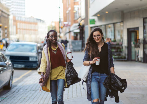 istock Young women walking together in London East End, UK 856100814