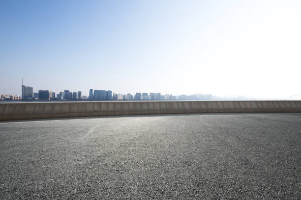 istock emtpy asphalt road with cityscape of modern city 856100938