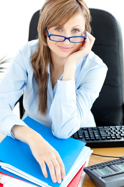 istock Smilling female doctor with glasses sitting in office 856101198