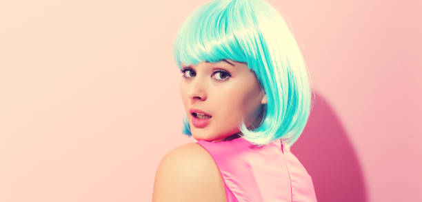 istock Beautiful woman in makeup with a bright blue wig 856101738
