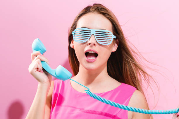 istock Young woman with old fashioned phone 856101746