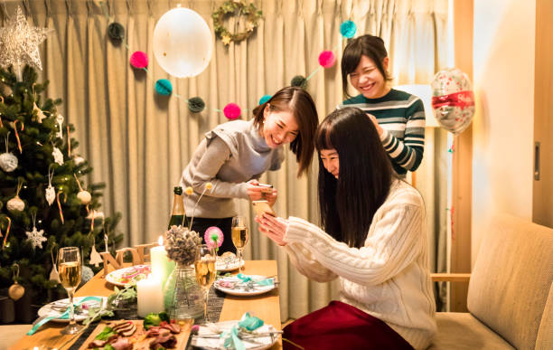 istock apanese girls enjoying a Christmas dinner party 856104328