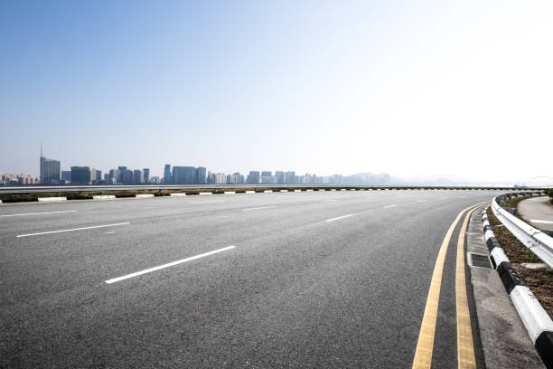 istock emtpy asphalt road with cityscape of modern city 856104376