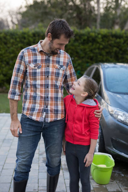 istock Young girl and father hugging each other 856104822