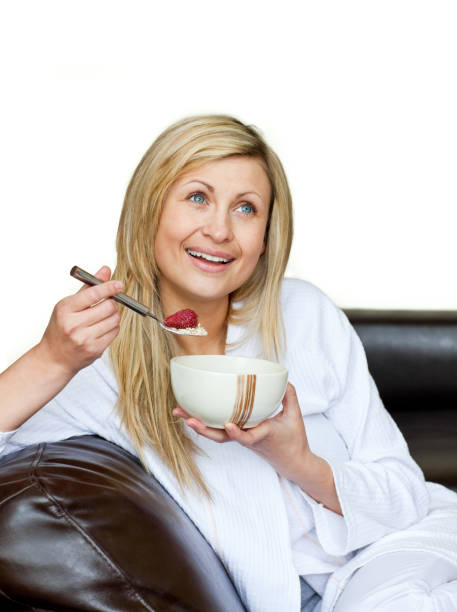 istock Attractive woman having a breakfast against a white background 856105686