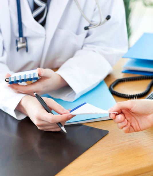 istock A doctor giving his patient a prescription 856108746
