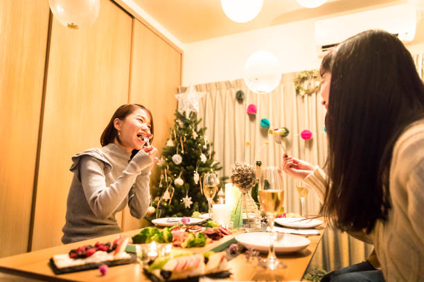 istock apanese girls enjoying a Christmas dinner party 856111904