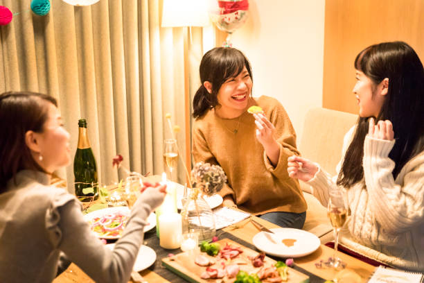 apanese girls enjoying a Christmas dinner party