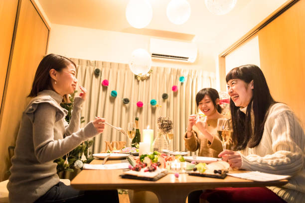 istock apanese girls enjoying a Christmas dinner party 856112238