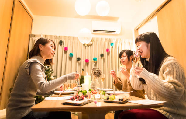 istock apanese girls enjoying a Christmas dinner party 856112296
