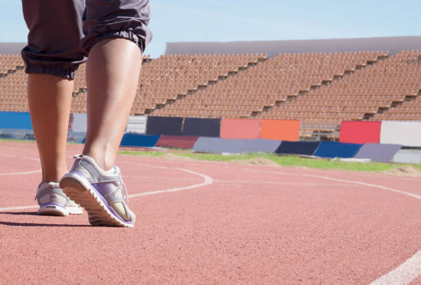 istock Sportswoman warm up at sport stadium before running competition 856133998