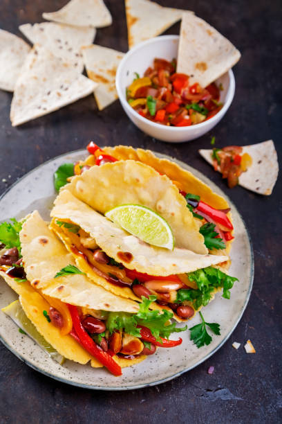 istock Tacos. Mexican yellow corn tortilla with chicken and vegetables 856136534