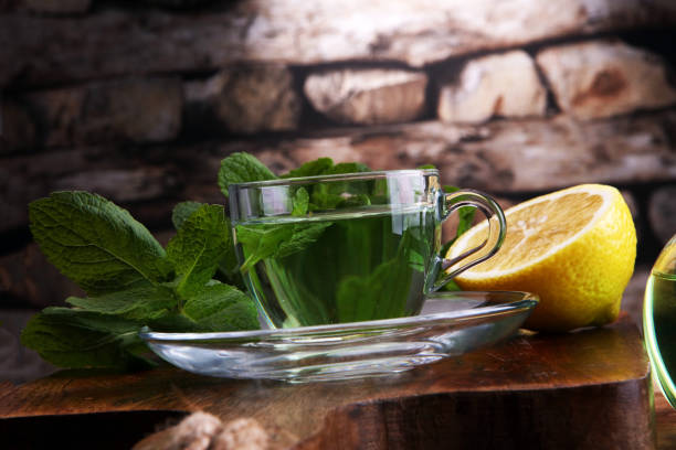 istock Cup of mint tea and leaves of mint on the table 856141032