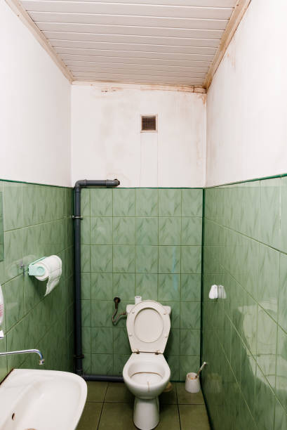 istock Wet stain on white wall in toilet. 856144814