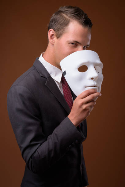 istock Studio shot of businessman wearing suit against colored background 856145090