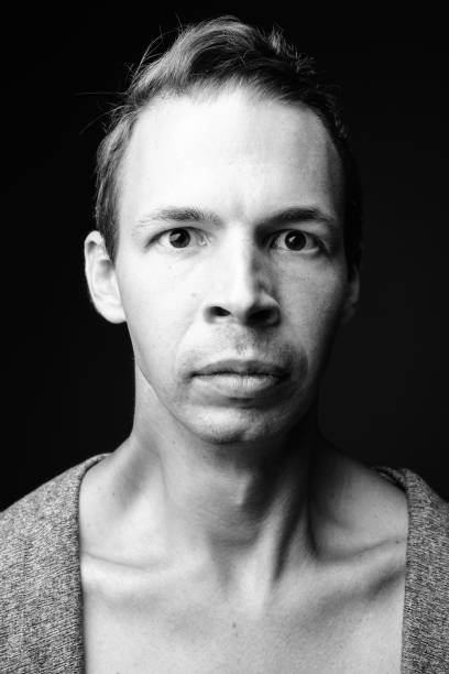 istock Studio shot of rebellious man against black background 856148738