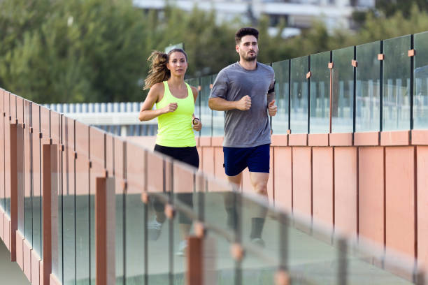 istock Beautiful couple running in the street. 856148902