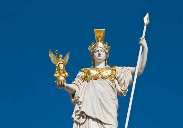 The statue of goddess Athena in front of the Austrian parliament in Vienna. The Athena Fountain (Pallas-Athene-Brunnen) in front of the Parliament was erected between 1893 and 1902 by Carl Kundmann, Josef Tautenhayn and Hugo Haerdtl.