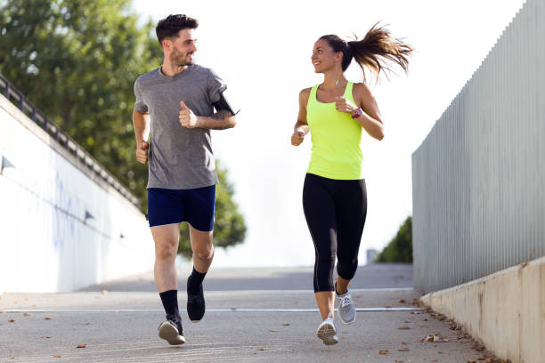 istock Beautiful couple running in the street. 856149270